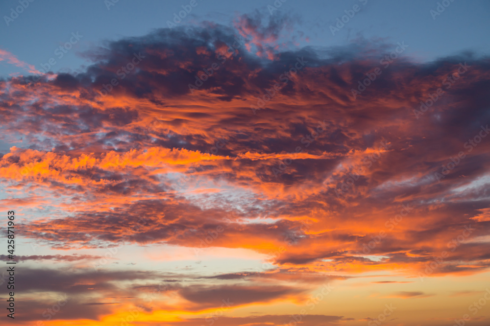 magical bright orange couds at sunrise as abstract cloud background