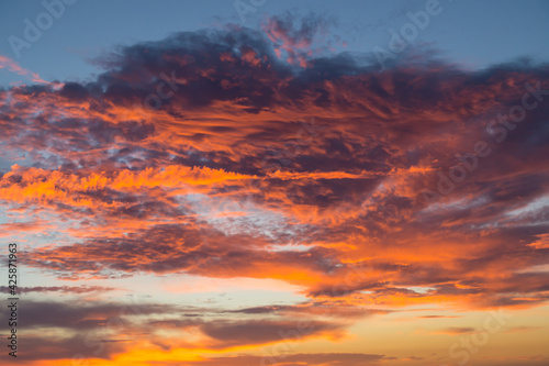 magical bright orange couds at sunrise as abstract cloud background