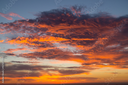 magical orange and pink clouds at sunrise abstract nature background