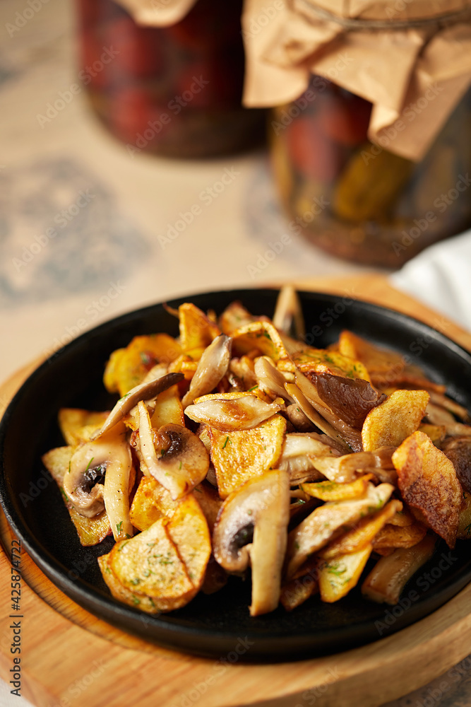 Potatoes with mushrooms, lenten menu, lunch at a restaurant Potatoes with mushrooms, lenten menu, lunch at a restaurant