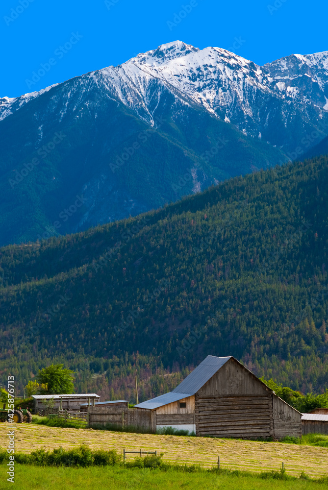 A farm and gorgeous mountains, British Columbia, Canada.
