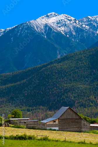 A farm and gorgeous mountains, British Columbia, Canada.