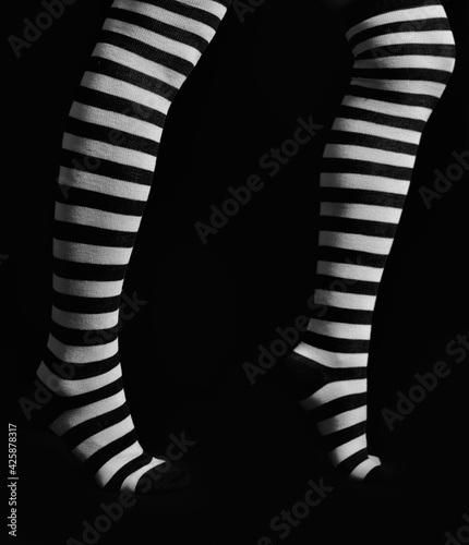 Legs with striped socks photo