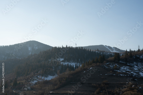 Snow-capped mountain peaks on a winter sunny day. Carpathians. Ukraine. The outskirts of the village of Slavsko.