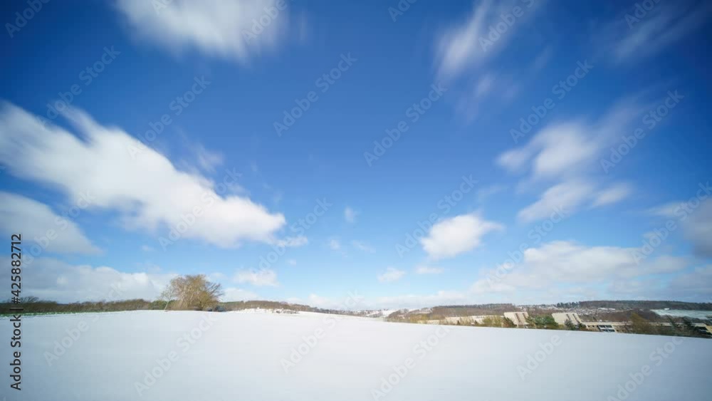 Clouds floating over a snow covered field. Winter time lapse Clouds floating over a snow covered field. Winter time lapse