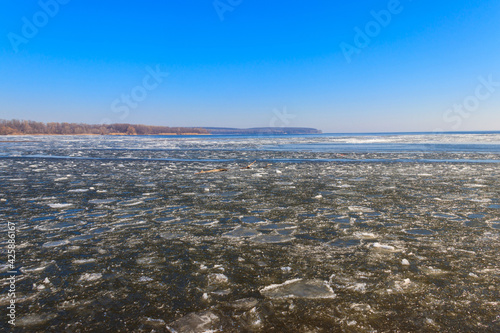 View of a lake with melting ice at spring