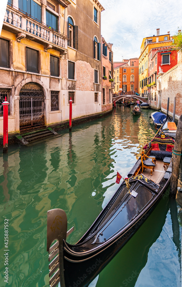 Moored gondola on a narrow canal in Venice, Italy, Europe
