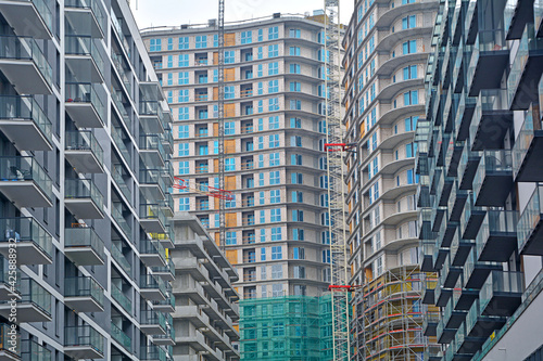 High-density and overcrowded housing and residential tower construction - ilustrating housing shortage, overpopulation and quick development