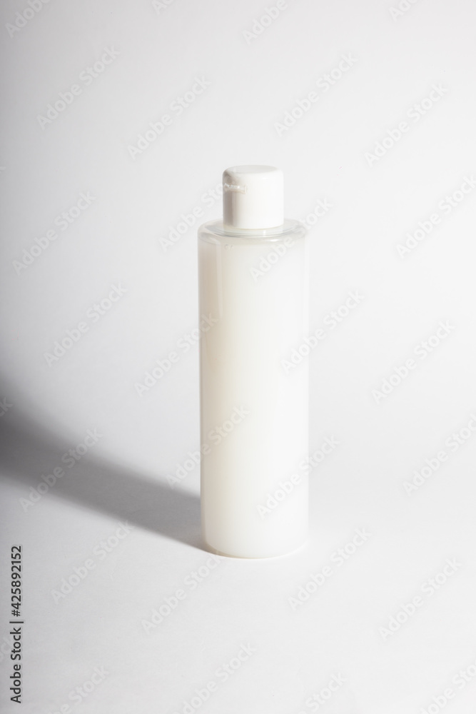 Plastic containers without labels or brand on a white background. Plastic containers without labels or brand on a white background.