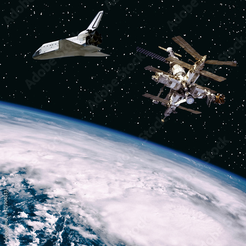 Fototapeta Naklejka Na Ścianę i Meble -  Spaceships above the earth. The elements of this image furnished by NASA.