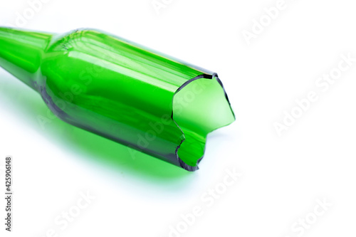 Green glass bottle broken isolated on white