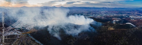 smoke and fire coming out of a mountain climate change