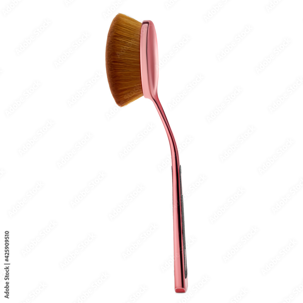 Rose gold cosmetic brush. High quality photo Rose gold cosmetic brush. High quality photo