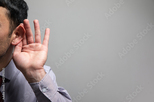 a man puts his ear in and listens