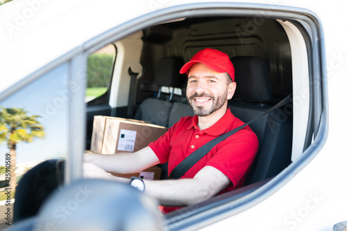 Hispanic male worker working as a delivery driver