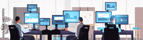 traders team stock market brokers analyzing charts graphs and rates on computer monitors at workplaces