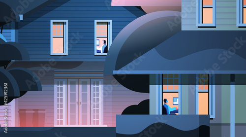 exterior of building with mix race neighbors virtual gamers playing online video games on personal computers