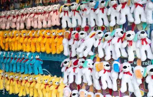 Plush toys and teddy bears hanging up as prizes at a carnival