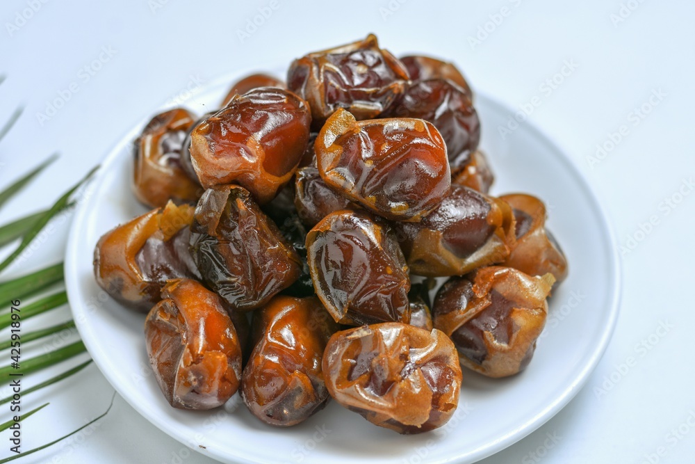 sweet dried palm fruit isolated on white background sweet dried palm fruit isolated on white background