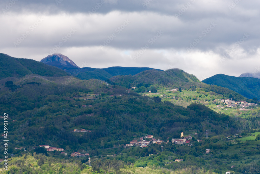 Spring in the Tuscan mountains. Villages and towns in the Italian Mountains. Panorama of old stone settlements.