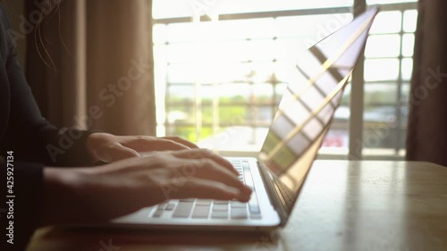 4K working form home on tablet computer, Extreme close-up Woman hands on keyboard 4K. businessman hands type on laptop keyboard business 4K Hands touch typing pointing cloud data social network media. photo