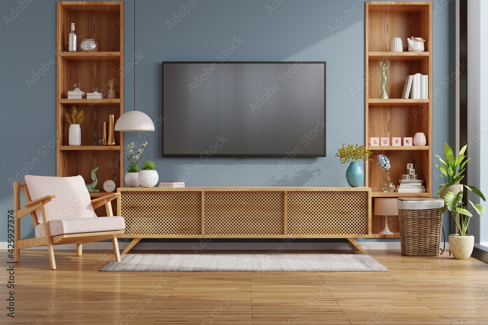 Mockup tv on cabinet in modern empty room with behind the dark blue wall.