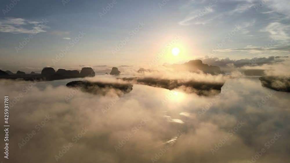 Aerial view in perspective of drone. View of sunset or sunrise. Over river and misty cloud in river. Mountain and sky sunset or sunrise background. Nature and travel concept. Aerial view in perspective of drone. View of sunset or sunrise. Over river and misty cloud in river. Mountain and sky sunset or sunrise background. Nature and travel concept.