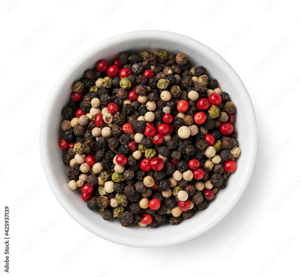 Pepper mix. Black, red, white, and green peppercorn on a white background. Pepper mix. Black, red, white, and green peppercorn on a white background.
