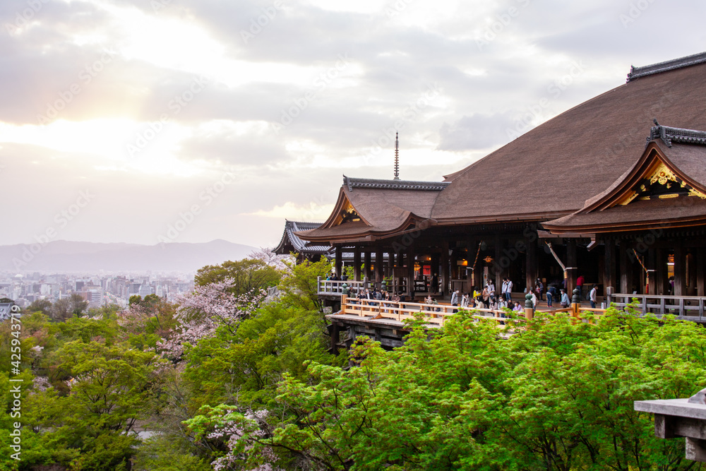 Otowa-san Kiyomizu-dera (Kiyomizu Dera Temple), a famous Buddhist temple in eastern Kyoto (Higashiyama Ward), at sunset in spring season in 2021. There are Sakura Cheery Blossom in image Otowa-san Kiyomizu-dera (Kiyomizu Dera Temple), a famous Buddhist temple in eastern Kyoto (Higashiyama Ward), at sunset in spring season in 2021. There are Sakura Cheery Blossom in image
