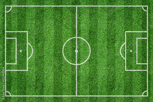 Grass soccer field with white pattern lines. Top view sport background.