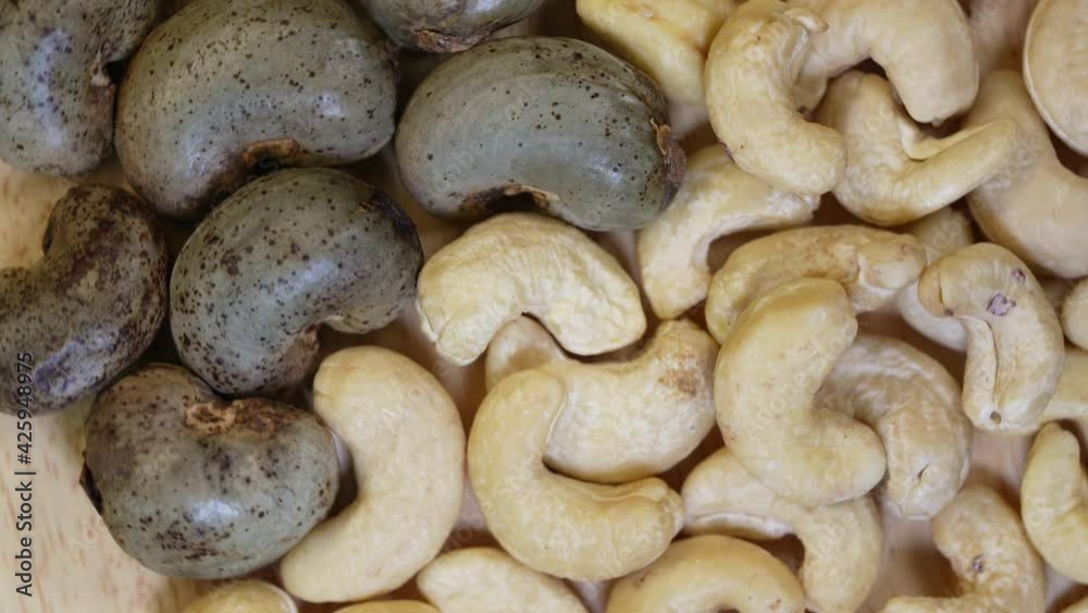 Top view Rotate Fresh cashew nut on wooden Background, 4K Top view Rotate Fresh cashew nut on wooden Background, 4K
