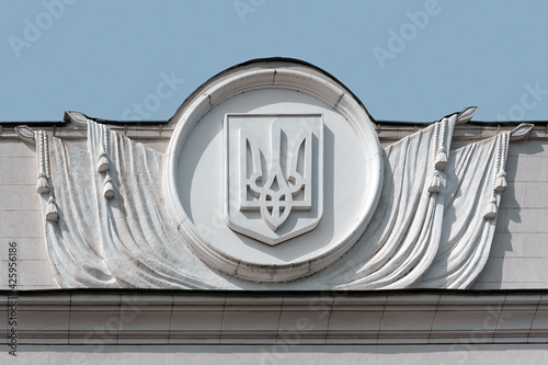 Ukrainian emblem on top of a Ukrainian Parliament building in Kyiv Ukraine photo