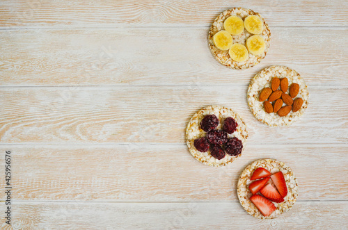 cereal breakfast crisp breads with strawberries, almonds nuts, banana fruit and blackberries