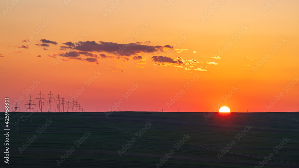 Colorful sunset over farm fields