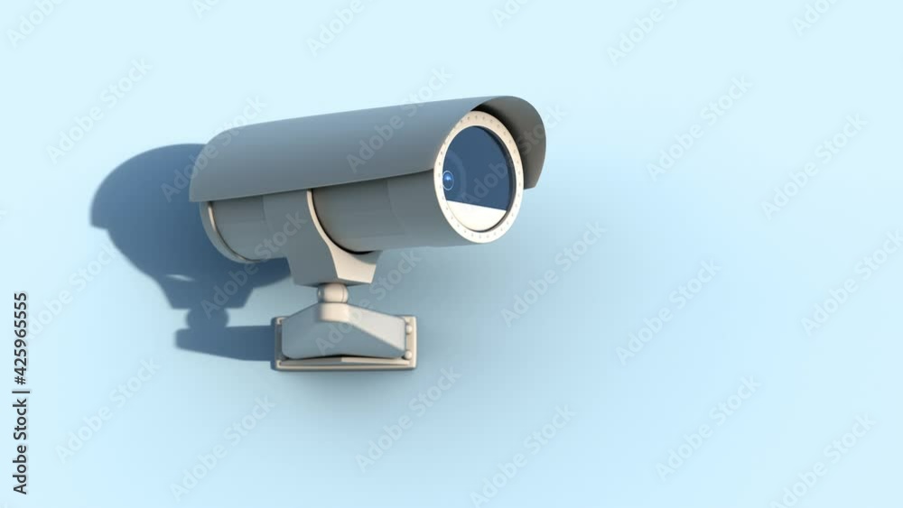 Surveillance video camera at the wall moving and scanning surrounding area Surveillance video camera at the wall moving and scanning surrounding area