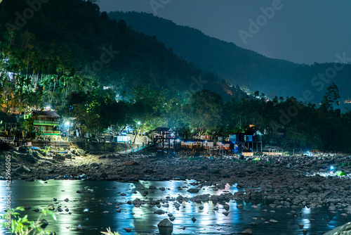 Beautiful night image of a village o a river bed in Meghalaya, India