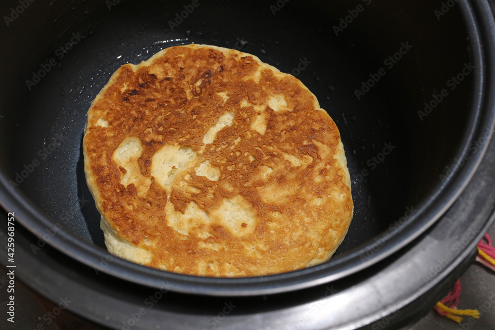 Baking flatbread in the multicooker kitchen machine.