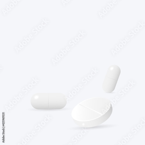 Two white medicine capsules. Medicament pills. Pharmaceutical drugs.