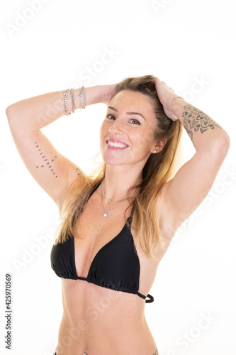 Attractive girl in swimwear tattoo young woman posing in white background