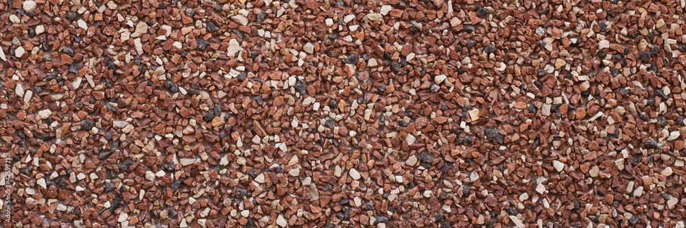 Texture of small stones, rocky abstract background, grainy surface, gravel pattern, red pebbles. Decorative design, brown colored. Grunge wall backdrop. Texture of small stones, rocky abstract background, grainy surface, gravel pattern, red pebbles. Decorative design, brown colored. Grunge wall backdrop.