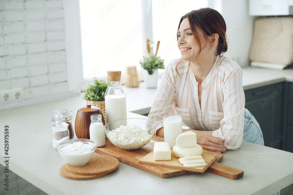Woman food. Young woman in the kitchen at home. High quality photo.