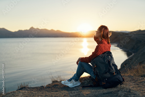 pretty woman tourist backpack vacation sun sunset