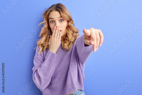 Surprised Young Female Pointing Finger At Camera, Copy Space For Advertisement