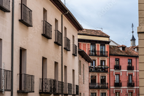 Old Traditional Residential Buildings in Central Madrid. Colorful Facades Against Cloudy Sky