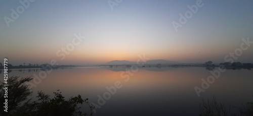 Sunrise over lake With Early Morning 