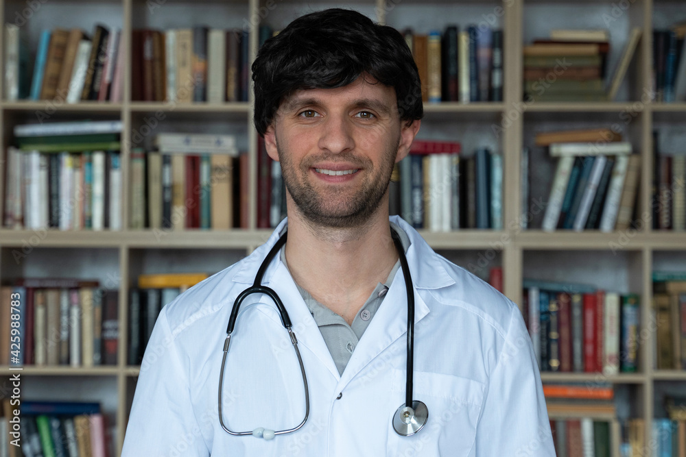 Young woman doctor in a library smiling happy. Concept medical care and welfare Young woman doctor in a library smiling happy. Concept medical care and welfare