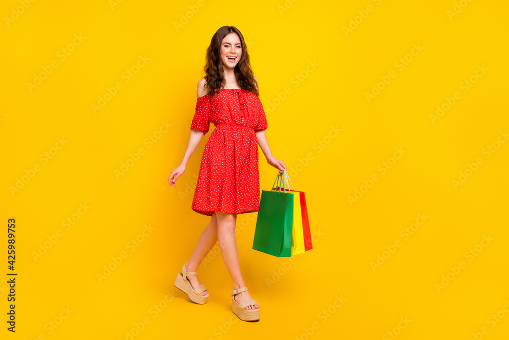 Full body profile photo of cheerful person toothy smile have fun look camera isolated on yellow color background