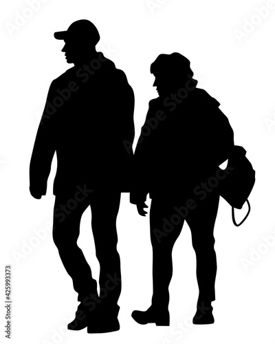Young man and woman walking down the street. Isolated silhouette on a white background