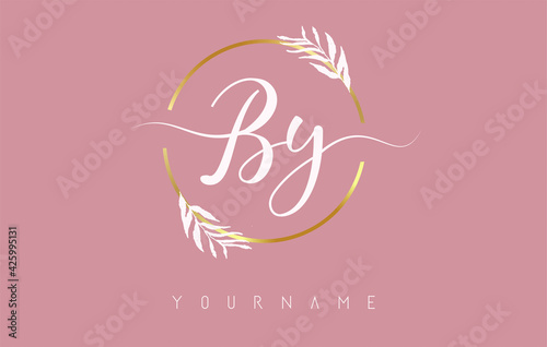 BY b y Letters logo design with golden circle and white leaves on branches around. Vector Illustration with B and Y letters. photo