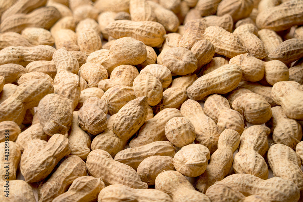 peanuts in a shell close - up for the whole frame peanuts in a shell close - up for the whole frame